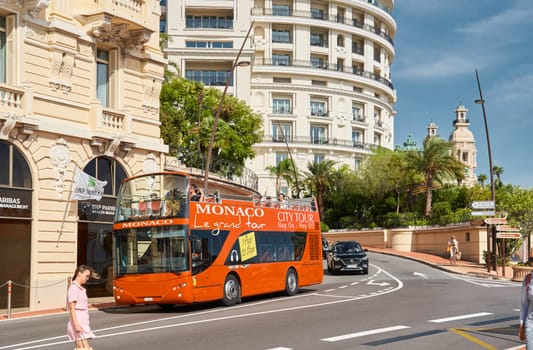 Monaco, Monte-Carlo, 29 September 2022 - Famous landmark Casino Monte-Carlo and hotel de Paris at sunny day, lifestyle of principality, wealth life, expensive luxury cars, sightseeing. High quality photo