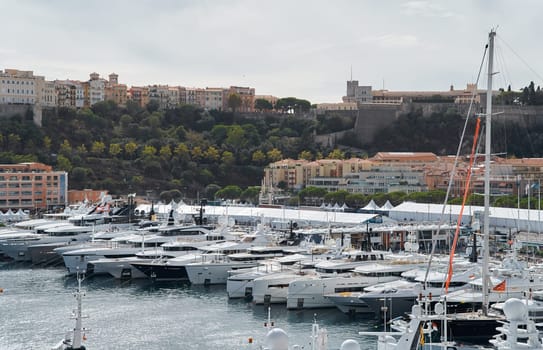 Monaco, Monte Carlo, 29 September 2022 - a lot of luxury yachts at the famous motorboat exhibition, the most expensive boats for the richest people, yacht brokers, boat traffic. High quality photo