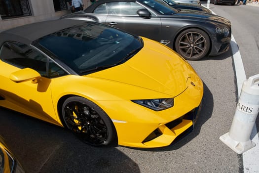 Monaco, Monte Carlo, 29 September 2022 - Close-up view of yellow sports car Lamborghini on street. High quality photo