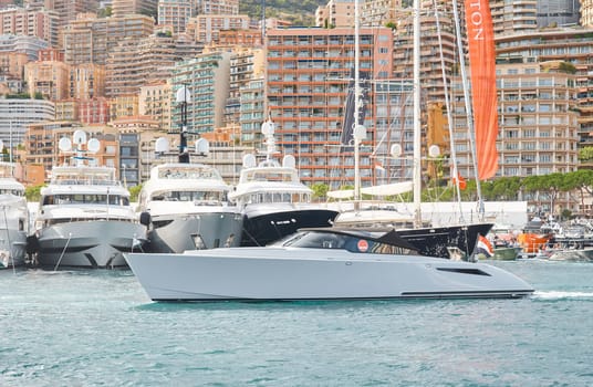 Monaco, Monte Carlo, 29 September 2022 - Water taxi by luxury motorboat on the famous yacht exhibition, a lot of most expensive luxury yachts, richest people, yacht brokers, boat traffic. High quality photo