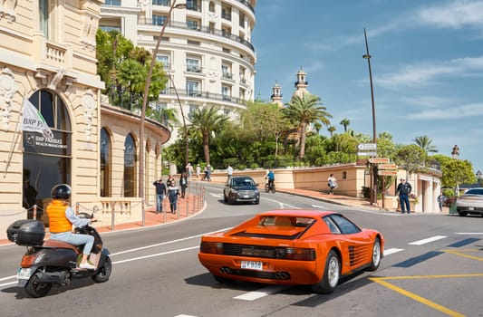 Monaco, Monte-Carlo, 29 September 2022 - Famous landmark Casino Monte-Carlo and hotel de Paris at sunny day, lifestyle of principality, wealth life, expensive luxury cars, sightseeing. High quality photo