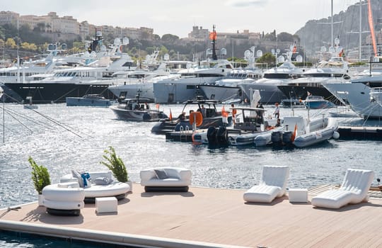 Monaco, Monte Carlo, 29 September 2022 - a lot of luxury yachts at the famous motorboat exhibition, the most expensive boats for the richest people, yacht brokers, boat traffic. High quality photo