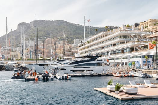 Monaco, Monte Carlo, 29 September 2022 - a lot of luxury yachts at the famous motorboat exhibition, the most expensive boats for the richest people, yacht brokers, boat traffic. High quality photo