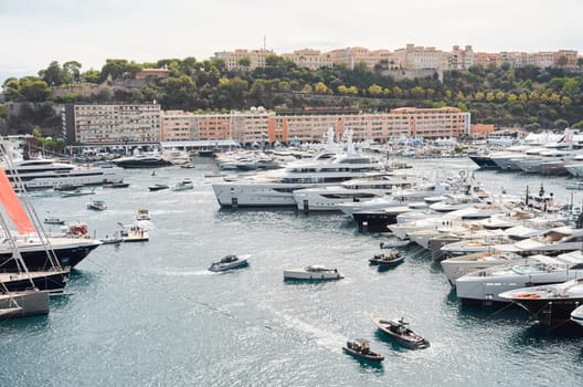 Monaco, Monte Carlo, 29 September 2022 - a lot of luxury yachts at the famous motorboat exhibition, the most expensive boats for the richest people, yacht brokers, boat traffic. High quality photo