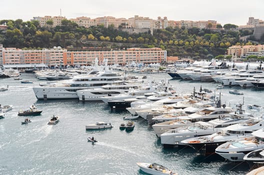 Monaco, Monte Carlo, 29 September 2022 - a lot of luxury yachts at the famous motorboat exhibition, the most expensive boats for the richest people, yacht brokers, boat traffic. High quality photo