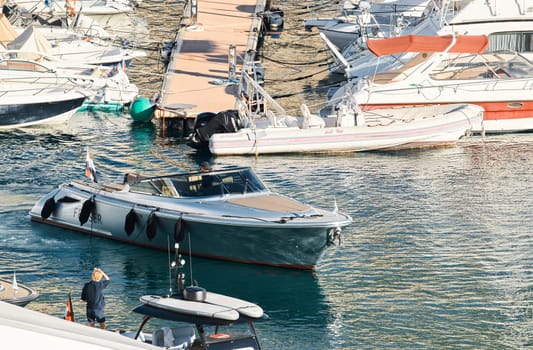 Monaco, Monte Carlo, 29 September 2022 - Water taxi by luxury motorboat on the famous yacht exhibition, a lot of most expensive luxury yachts, richest people, yacht brokers, boat traffic. High quality photo