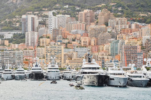 Monaco, Monte Carlo, 29 September 2022 - a lot of luxury yachts at the famous motorboat exhibition, the most expensive boats for the richest people, yacht brokers, boat traffic. High quality photo