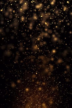 Dark background with golden glowing. Small gold particles on a black background