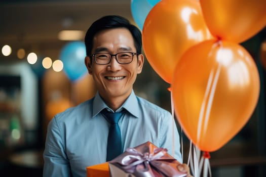 People, joy, fun and happiness concept. happy japanese birthday man holding with gift box, balloons in the background. AI Generated