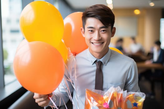 People, joy, fun and happiness concept. happy Asian birthday man holding with gift box, balloons in the background. AI Generated