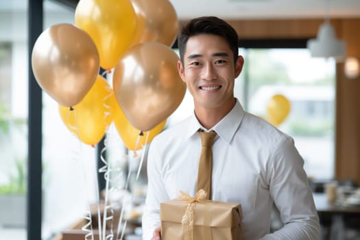 People, joy, fun and happiness concept. happy Asian birthday man holding with gift box, balloons in the background. AI Generated
