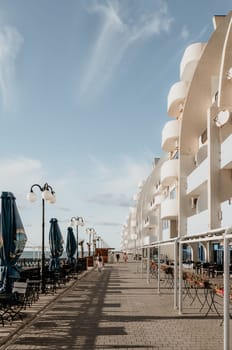 coastal area with apartment buildings of residential areas, modern hotel and restaurant complex on water and sandy beaches