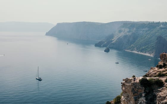 Aerial panoramic view of beautiful sunset above sea. Beautiful seascape. Sun glare, small waves on the water surface. Evening. Horizon. Nobody. No people. Copy space. Never-ending beauty of nature