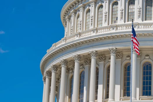 Washington DC Capitol detail with waving american flag