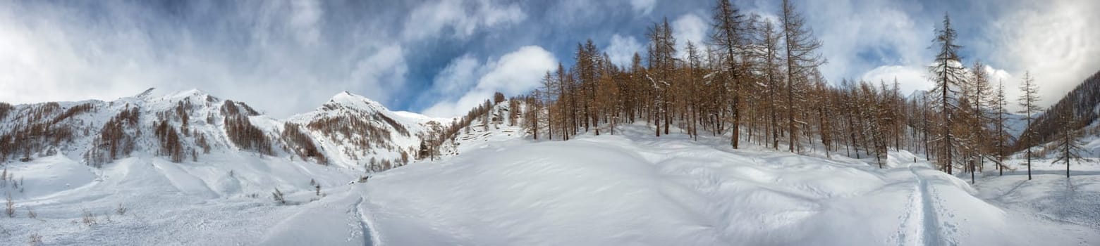 High mountain snow path in winter time sunny view huge landscape