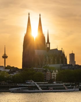 COLOGNE, GERMANY - JULY 10, 2023: Cathedral of Cologne against sunset on July 10, 2023 in Germany, Europe