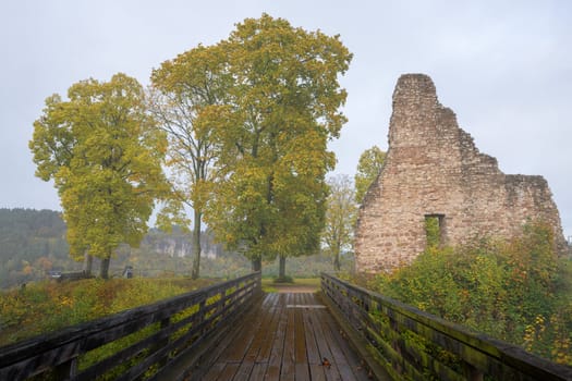 GEROLSTEIN, GERMANY - OCTOBER 22, 2023: Panoramic image of old Gerolstein castle in foggy light during autumn on October 22, 2023 in Eifel, Rhineland-Palatinate, Germany