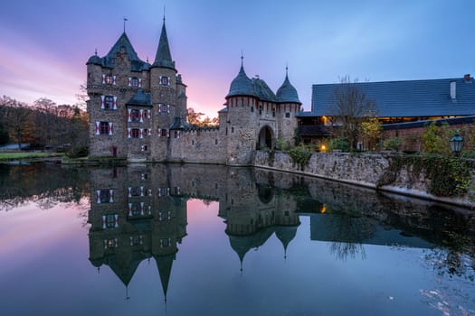 MECHERNICH, GERMANY - NOVEMBER 22, 2023: Panoramic image of old Satzvey castle during evening on November 22, 2023 in Eifel, North Rhine Westphalia, Germany