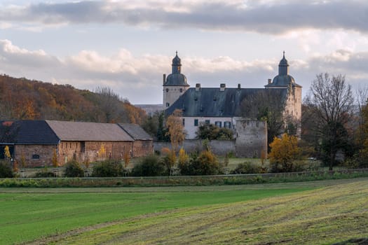 MECHERNICH, GERMANY - NOVEMBER 19, 2023: Panoramic image of old Veynau castle during evening on November 19, 2023 in Eifel, North Rhine Westphalia, Germany