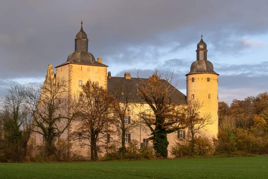 MECHERNICH, GERMANY - NOVEMBER 19, 2023: Panoramic image of old Veynau castle during evening on November 19, 2023 in Eifel, North Rhine Westphalia, Germany