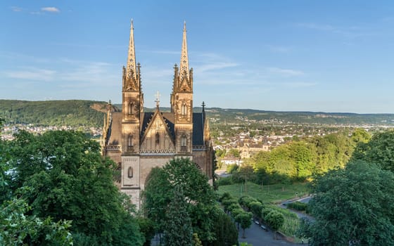 REMAGEN, GERMANY - JULY 6, 2023: Panoramic image of Apollinaris church against blue sky on July 6, 2023 in Remagen, Germany