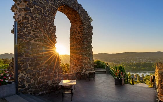 REMAGEN, GERMANY - JULY 7, 2023: Castle ruin Rolandsbogen against sunrise on July 7, 2023 in Remagen, Rhine Valley, Germany