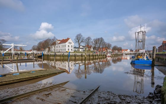 TOENNING, GERMANY - MARCH 9, 2023: Harbor of Frisian city Toenning on a sunny day during springtime on March 9, 2023 in North Frisia, Germany
