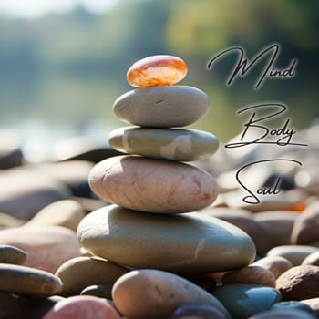 Mind, Body and Soul text with zen stones background. Inspirational and living life concept