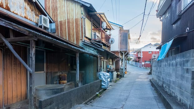 Narrow road between old houses in small town Japan. High quality photo