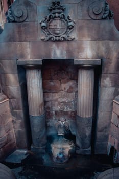 Lion's fountain with thermal water in Catalonia, Spain. Caldes de Montbui Barcelona Province. Old fountain 77 celsius degrees thermal water. High quality picture for wallpaper, travel blog.