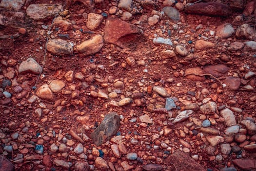 Soil with stones, clay layers photo. Slice of sand with layers of different structures. Layers of sedimentary sandstone rock. High quality picture for article