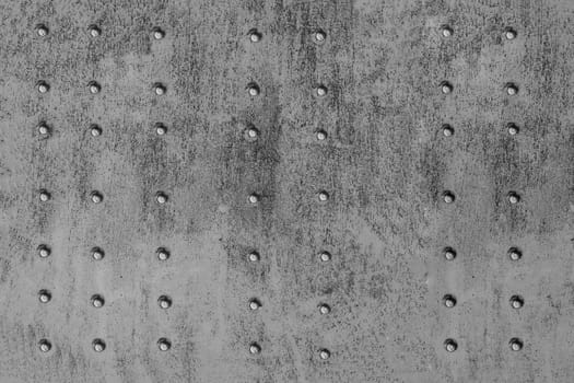 Old metal background with rivets. Riveted metal surface,