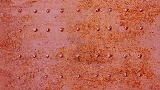 Old metal background with rivets. Vintage abstract texture.