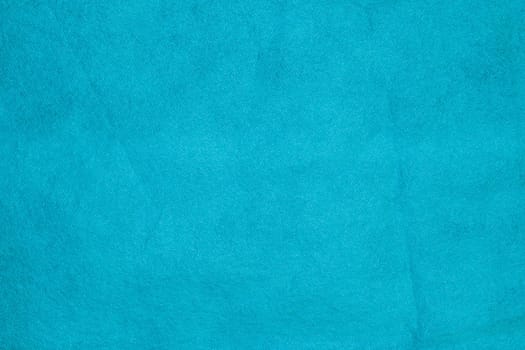 Blue nonwoven polypropylene material texture background.