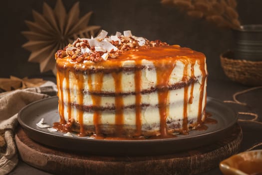 Delicious caramel cake with small pieces of pecan nuts and coconut shavings.