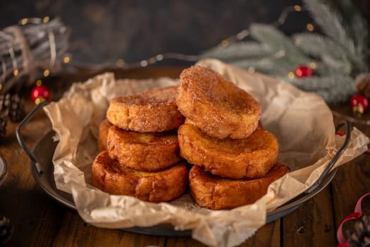 Traditional Portuguese Christmas Rabanadas. Spanish Torrijas on kitchen countertop.