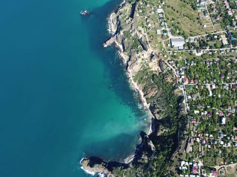 Aerial panoramic view of beautiful sunset above sea. Beautiful seascape. Sun glare, small waves on the water surface. Evening. Horizon. Nobody. No people. Copy space. Never-ending beauty of nature