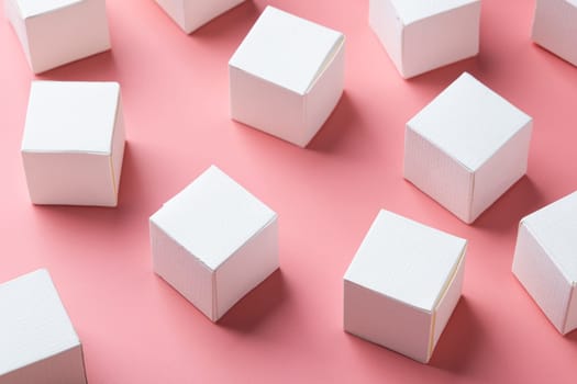 blank white block cubes on wooden table over light pink wall, Business communication concept