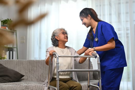 Caring healthcare worker talking while visiting senior woman patient at home. Healthcare concept