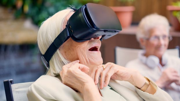 Photo of a shocked old woman using Virtual reality goggles in a geriatric