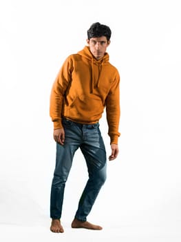 Full body shot of attractive young man with sweater and jeans, isolated on white background