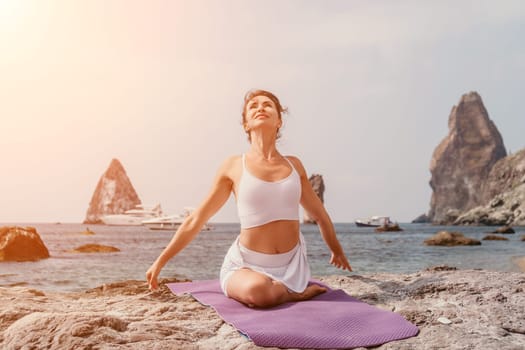 Fitness woman sea. Outdoor workout on yoga mat in park near to ocean beach. Female fitness pilates yoga routine concept. Healthy lifestyle. Happy fit woman exercising with rubber band in park.