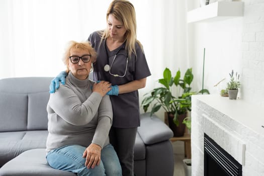 Happy patient is holding caregiver for a hand while spending time together