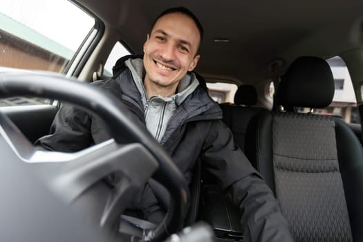 Attractive elegant happy man in good car. High quality photo