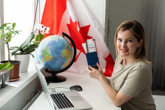 Beautiful young woman with flag of Canada . High quality photo