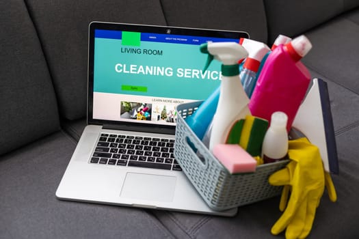 Basket with cleaning items on blurry spring background. High quality photo