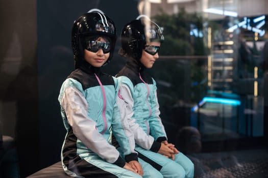 wind tunnel and a teenage girl in a helmet. High quality photo