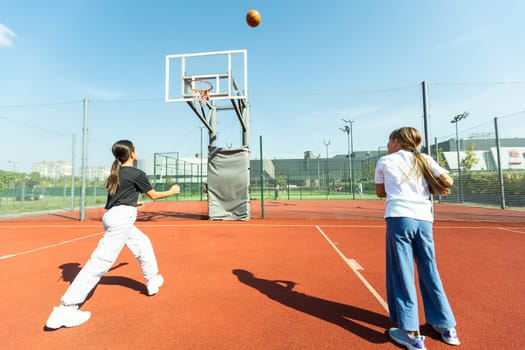 girls playing basketball on the basketball court. High quality photo
