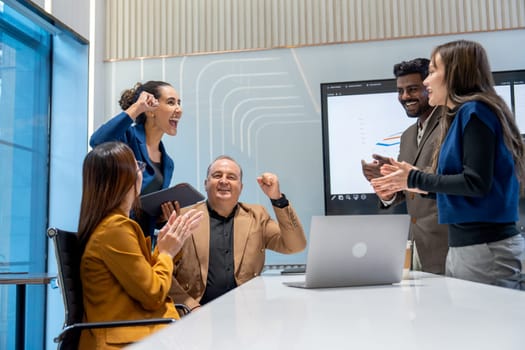 Business men and women with multiethnic and multigeneration show action of fighting in the conference room to get the success of the project.