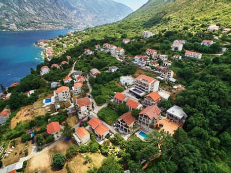 Resort town at the foot of the mountains on the seashore. Drone. High quality photo